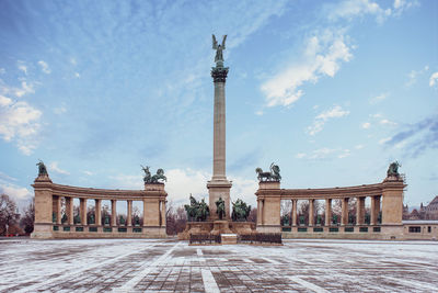 Low angle view of historic building against sky - heroes square in the morning in winter budapest