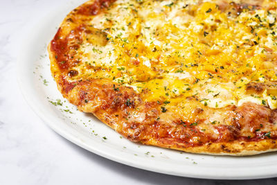 High angle view of pizza in plate on table