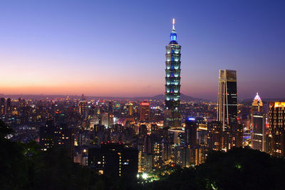 Illuminated buildings in city at night