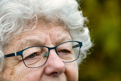 Close-up portrait of woman wearing eyeglasses