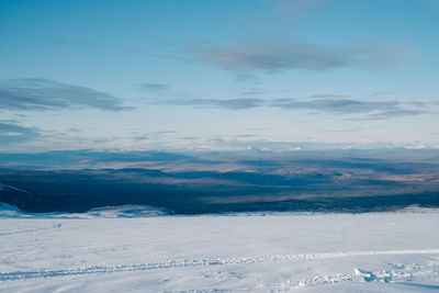 Scenic view of snowcapped mountains against sky