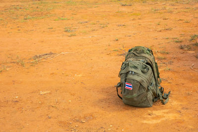 Backpack on dirt road