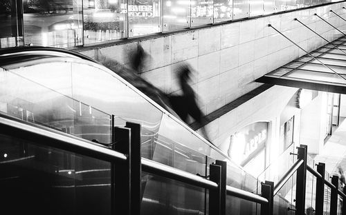 High angle view of people walking on staircase