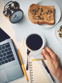 High angle view of coffee cup on table