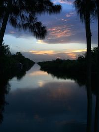 Scenic view of lake at sunset