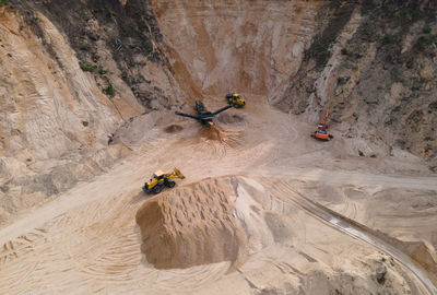 High angle view of people on rock