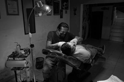 Rear view of people at home