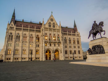 Facade of historic building against sky