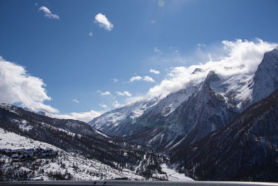 Scenic view of snowcapped mountains against sky