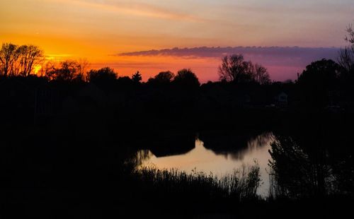 Scenic view of lake at sunset