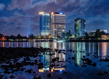 Reflection of illuminated buildings in water at night