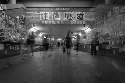 People walking in illuminated city