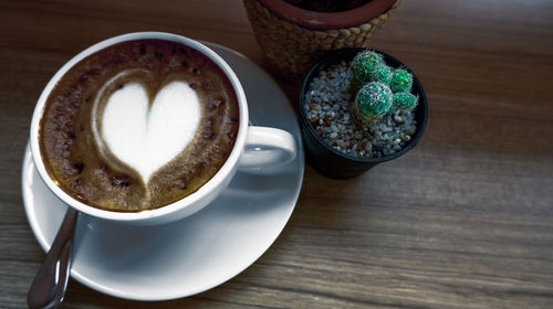 High angle view of coffee cup on table