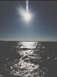 Sun shining over sea