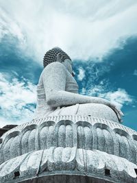 Low angle view of statue against cloudy sky