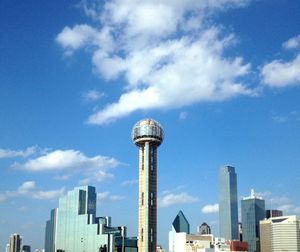 Reunion tower and modern buildings against sky