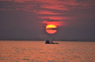 Scenic view of sea at sunset