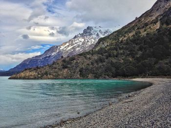 Scenic view of mountains against cloudy sky