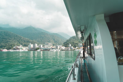 Panoramic view of sea and mountains against sky