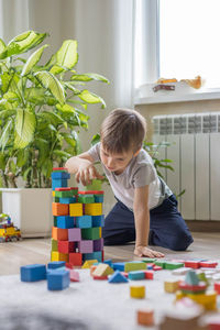 Boy playing with toy blocks
