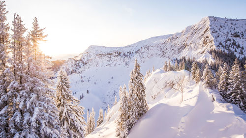 Scenic view of snow covered mountains against sky