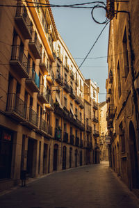 Narrow alley amidst buildings in city