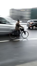 Blurred motion of man riding motorcycle