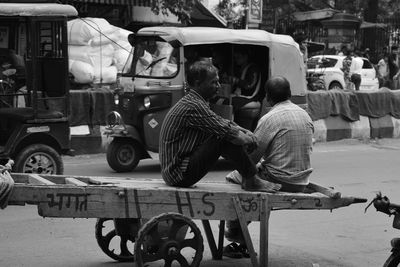 Rear view of man working on road