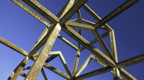 Low angle view of metallic structure against sky