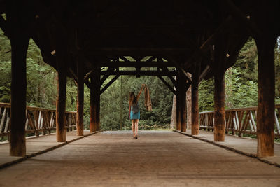 Rear view of woman walking on walkway