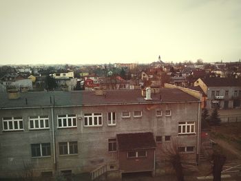 Houses in town against sky