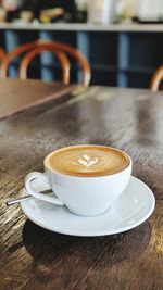 Close-up of coffee cup on table