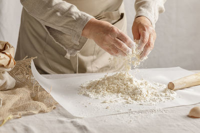 Midsection of man preparing food