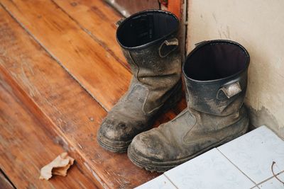 High angle view of old shoes on floor