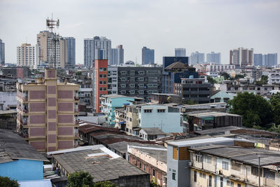 Buildings in city against sky