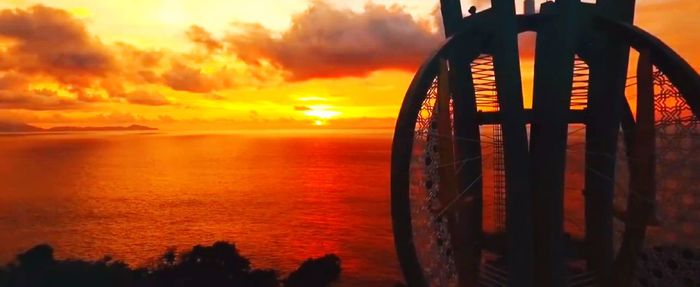 Close-up of sea against orange sky