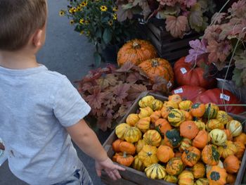 Full length of man having fruits at market