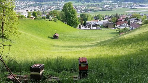 High angle view of houses on field by buildings