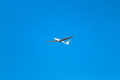 Low angle view of airplane flying in sky