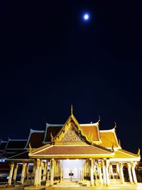 Low angle view of illuminated temple against sky at night