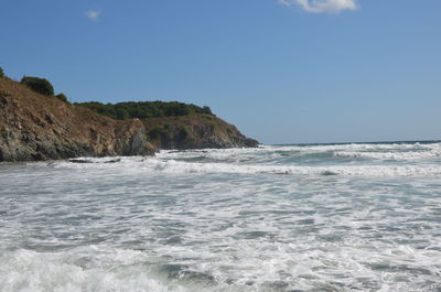 Scenic view of beach and sea against clear sky