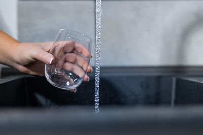 Close-up of hand holding glass