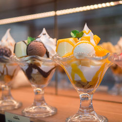 Close-up of ice cream sundaes on table