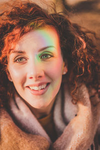 Close-up portrait of redhead woman in warm clothing