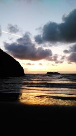 Scenic view of sea against cloudy sky