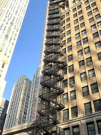 Low angle view of modern buildings against clear sky