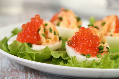 Stuffed eggs with salmon caviar are a popular appetizer for any occasion.  