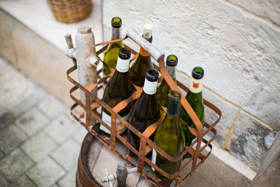 High angle view of wine bottles in metal crate