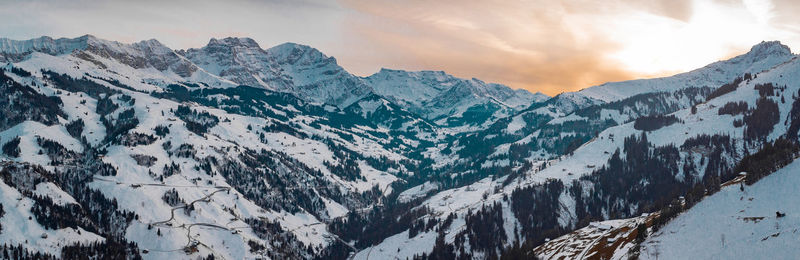 Panoramic view of snowcapped mountains against sky