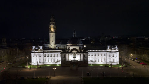 Illuminated buildings in city at night